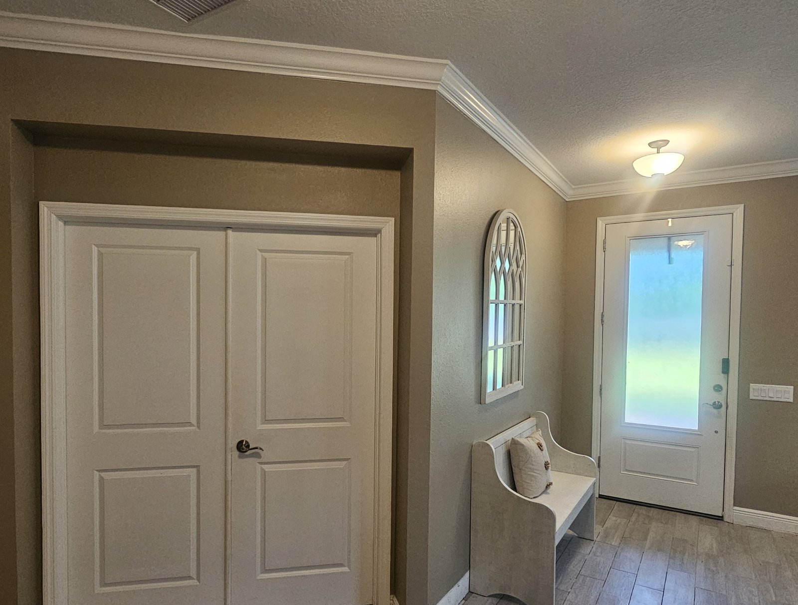 Entryway wall treatment before and after visual